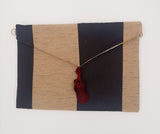POCHETTE RIGATA NERO ORO CON NAPPINA BORDEAUX